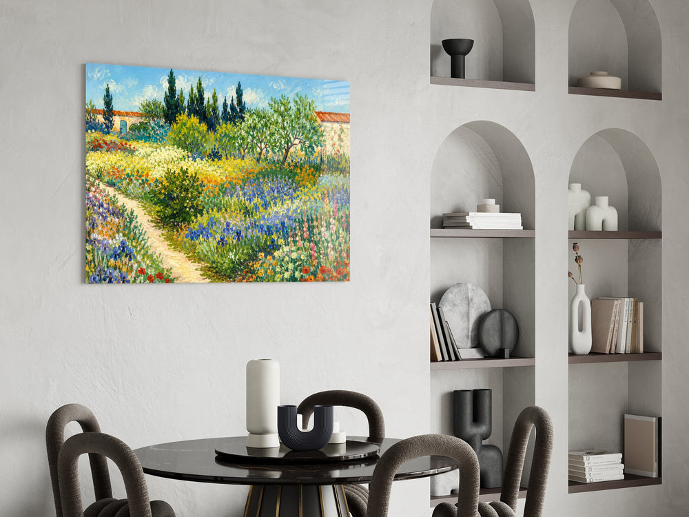 impressionist flower garden with a path glass wall art leaning beside a dark leather sofa