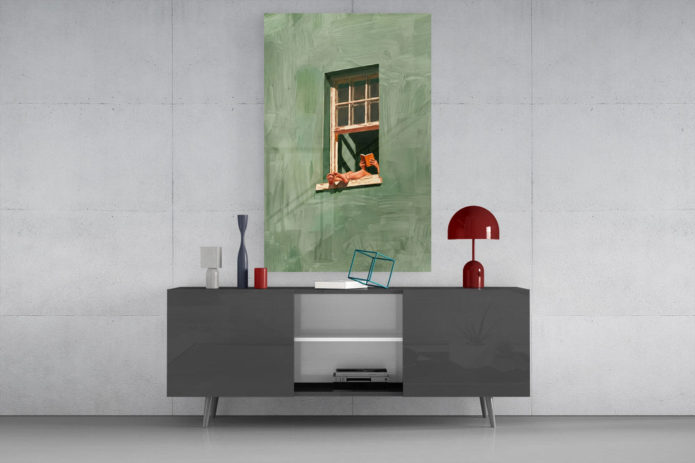a reader lounging on a windowsill glass wall art styled in an atmospheric room setting