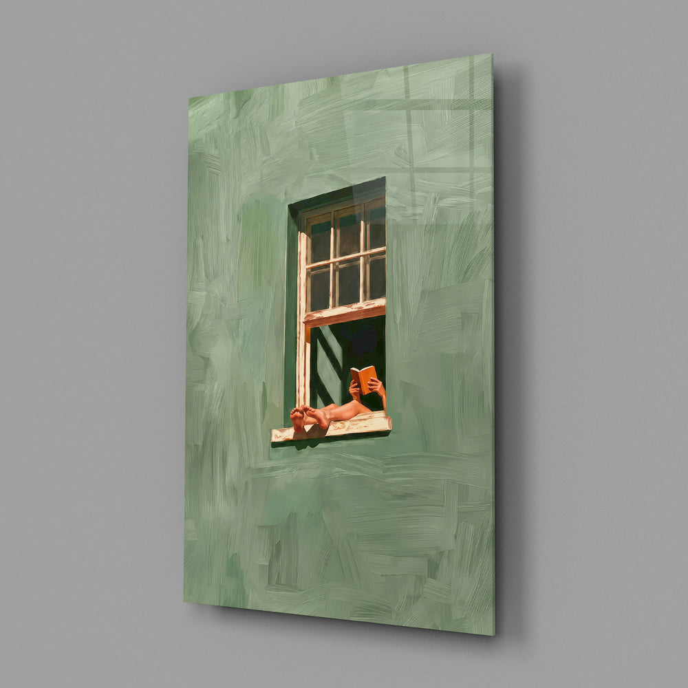 a reader lounging on a windowsill glass wall art angled to show the polished tempered glass panel