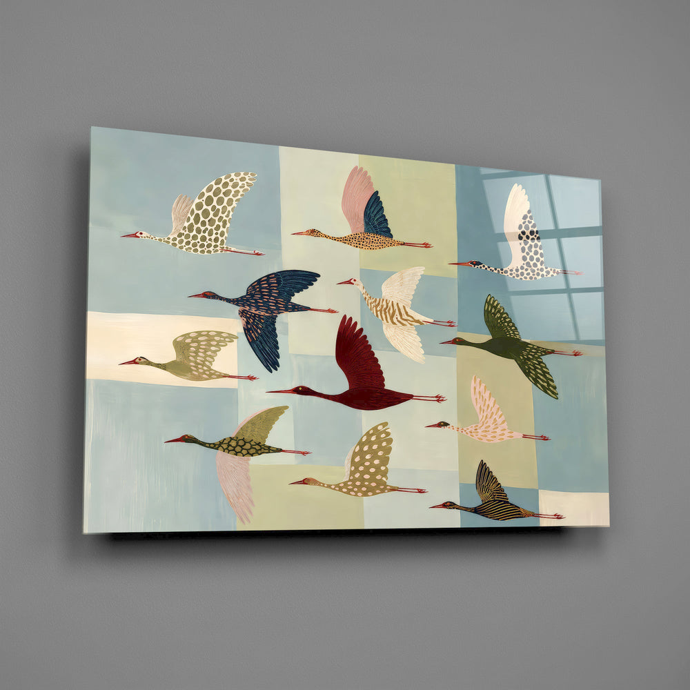 a flock of stylized cranes in flight glass wall art angled to show the polished tempered glass panel