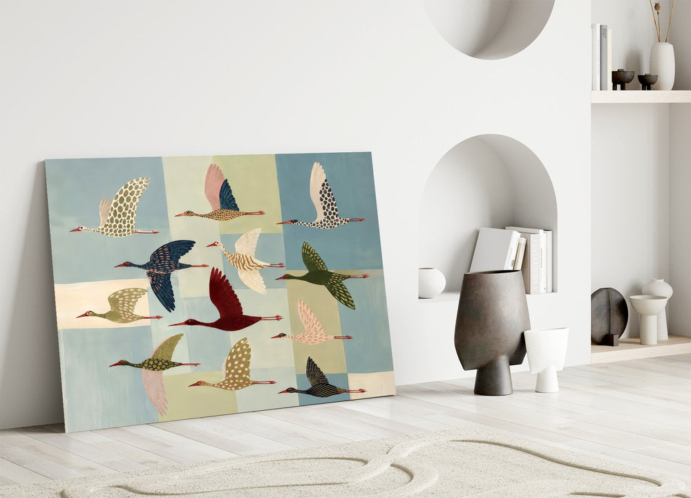 a flock of stylized cranes in flight panel bringing character to a minimalist living room wall