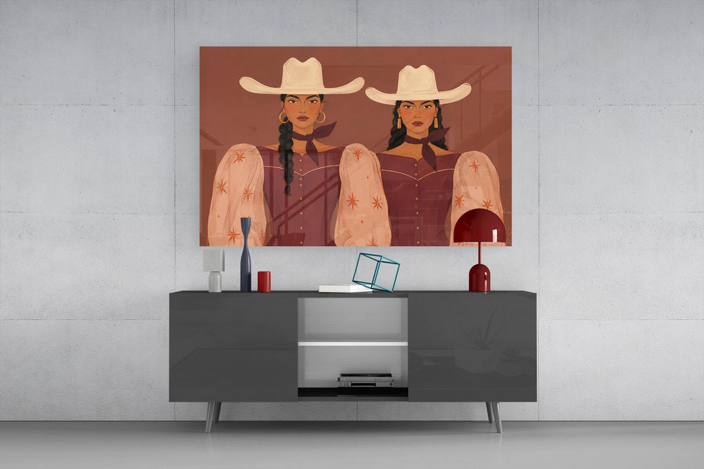 two cowgirls in matching western dresses glass wall art styled in an atmospheric room setting