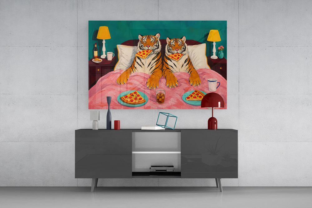 two tigers lounging in bed with pizza glass wall art styled in an atmospheric room setting