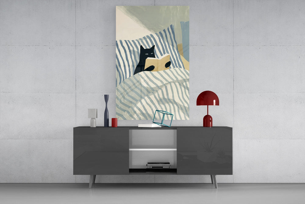 black cat reading in striped bedding glass wall art styled in an atmospheric room setting
