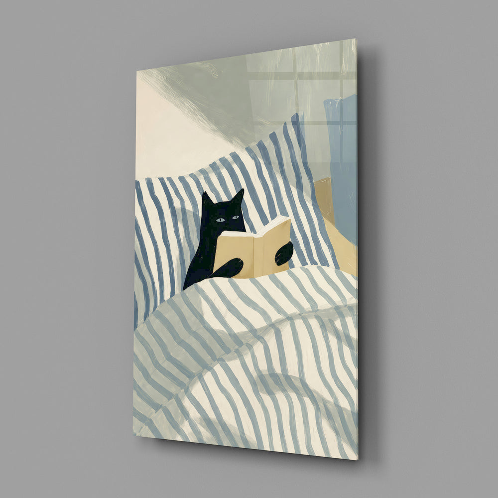 black cat reading in striped bedding glass wall art angled to show the polished tempered glass panel