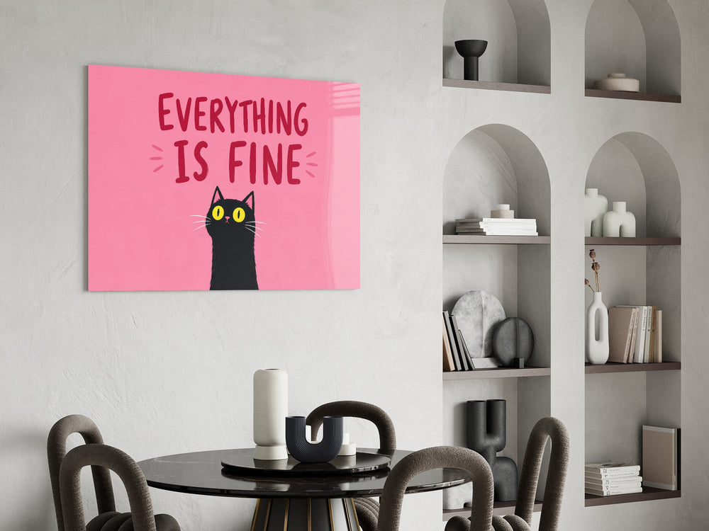 startled black cat on hot pink glass wall art leaning beside a dark leather sofa