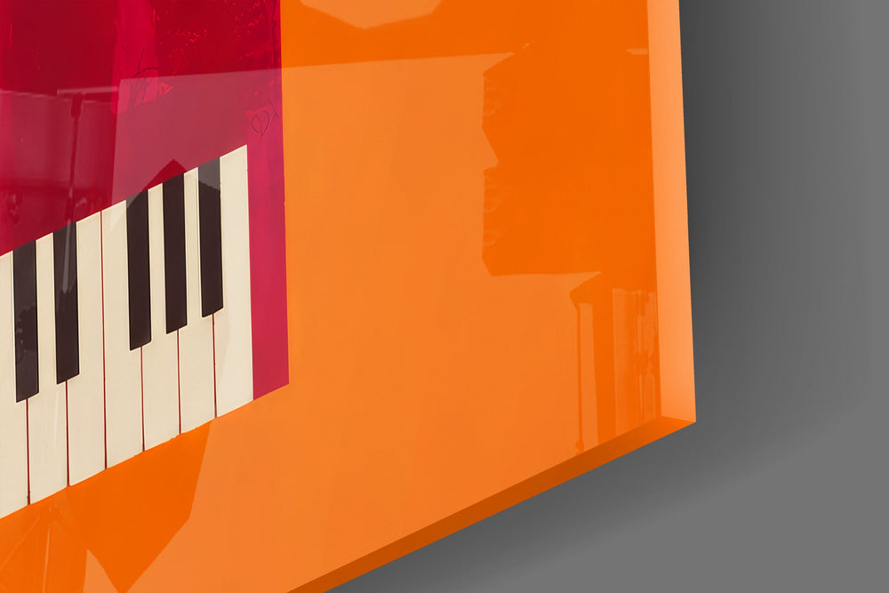 Close-up detail of the black and white keyboard against the crimson case on the glass surface