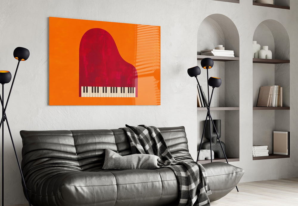 red grand piano on orange glass wall art styled above an armchair in a reading corner