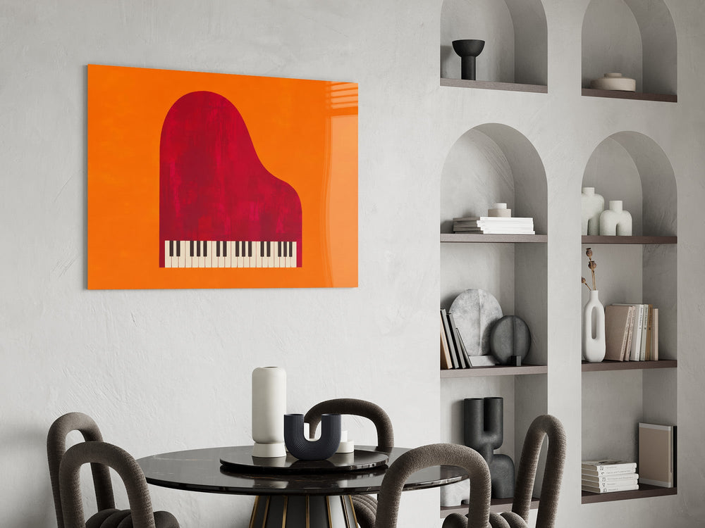 red grand piano on orange glass wall art leaning beside a dark leather sofa
