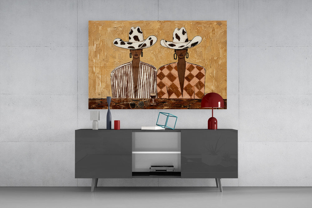 two women in cow-print cowboy hats glass wall art styled in an atmospheric room setting