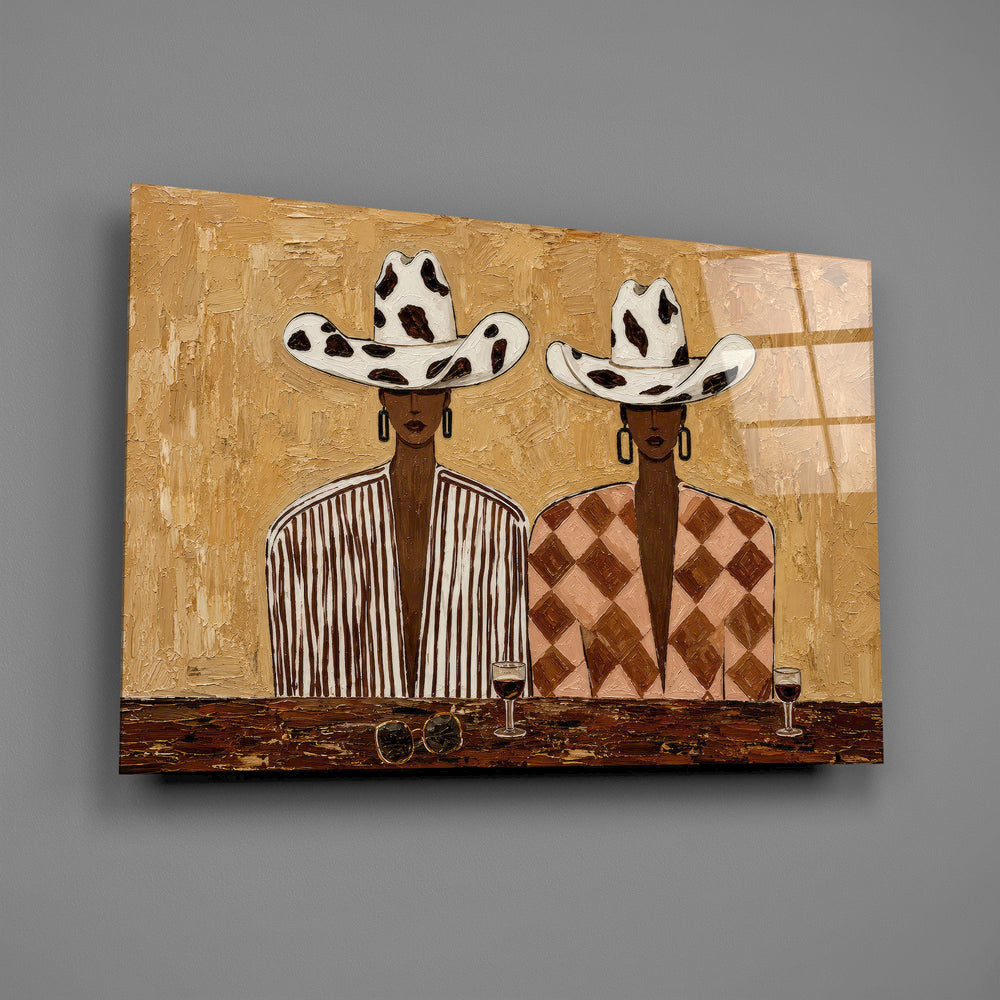 two women in cow-print cowboy hats glass wall art angled to show the polished tempered glass panel