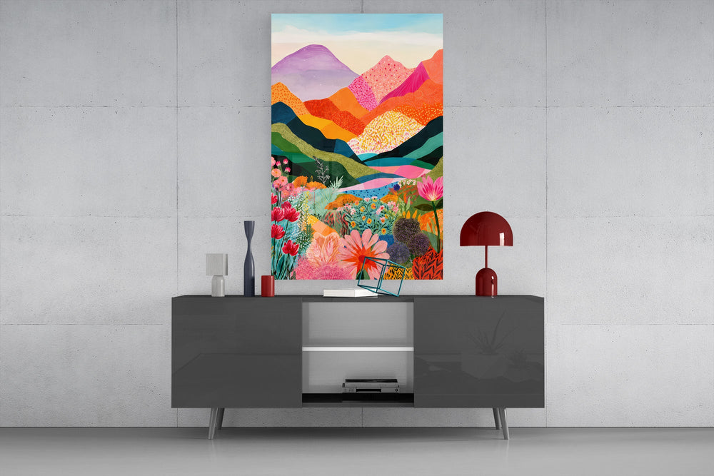 colorful layered mountains above a flower valley glass wall art styled in an atmospheric room setting