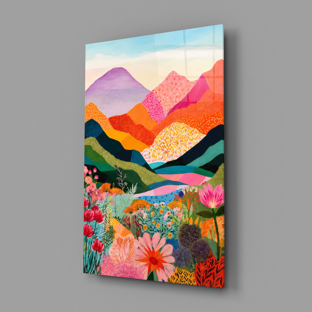 colorful layered mountains above a flower valley glass wall art angled to show the polished tempered glass panel