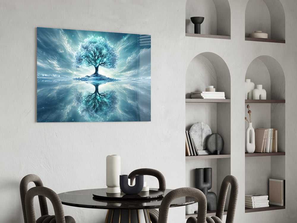 frozen turquoise tree in a winter landscape glass wall art leaning beside a dark leather sofa