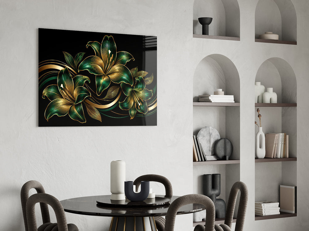 emerald and gold lilies on black glass wall art leaning beside a dark leather sofa
