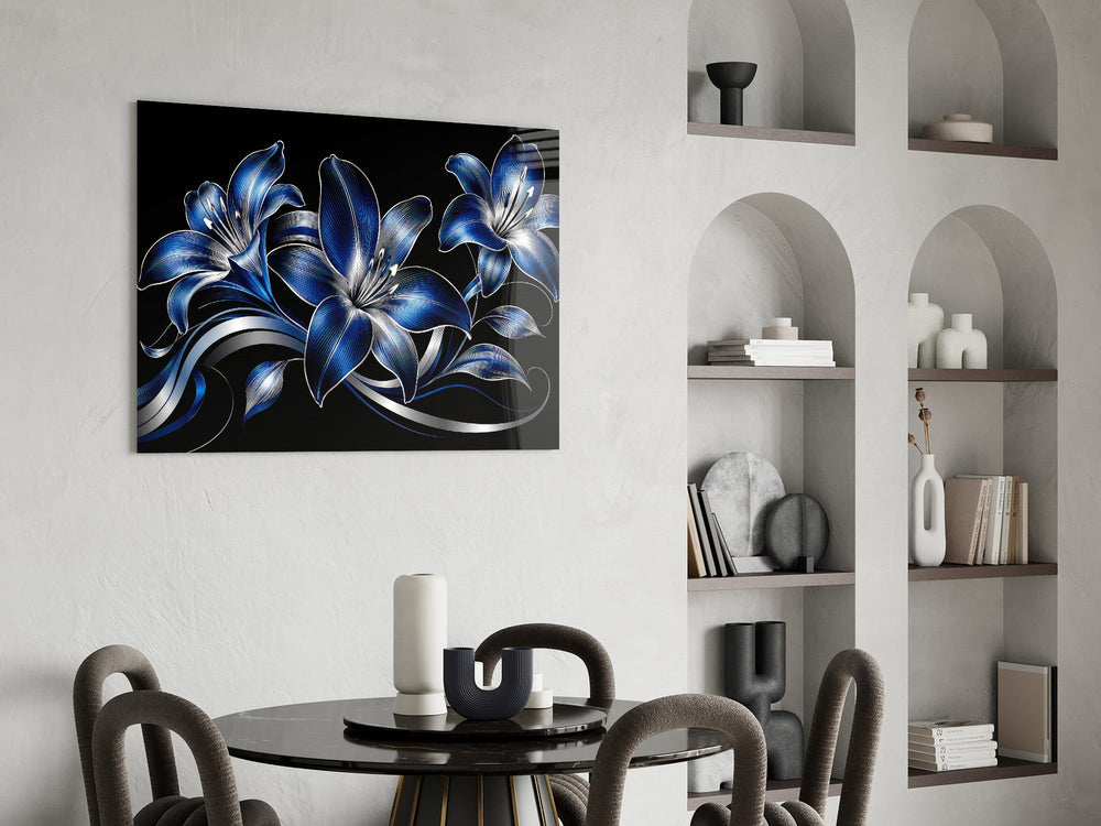 sapphire blue and silver lilies on black glass wall art leaning beside a dark leather sofa