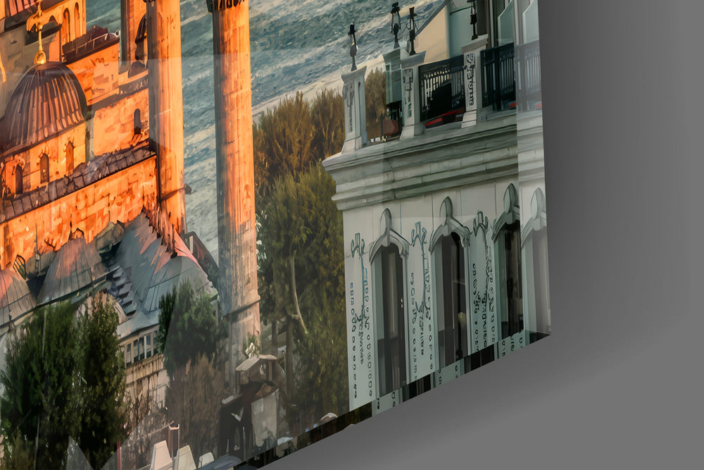 Close-up detail of the sunlit domes and slender minarets on the glass surface