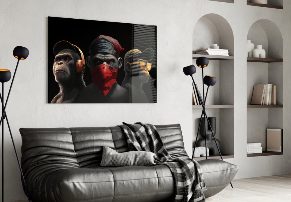 3 Wise Monkey glass wall art styled above a desk in a study
