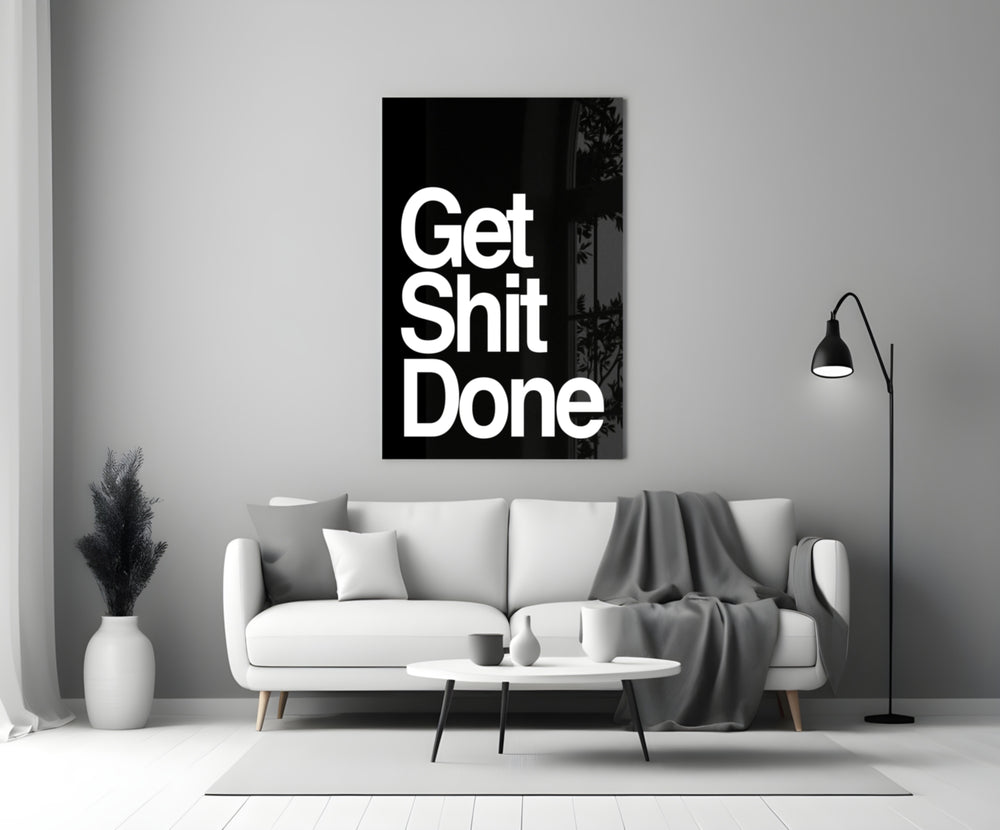 Get Shit Done glass wall art styled above a console in a study