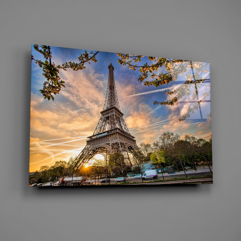 Close-up detail of the Eiffel Tower silhouette framed by autumn branches