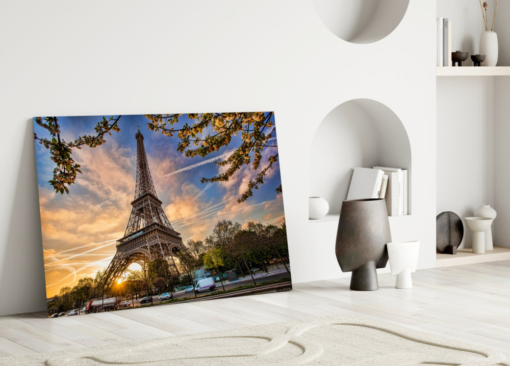 Eiffel Tower glass wall art styled above a modern sofa in a warm neutral living room
