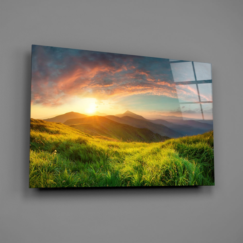 Close-up detail of the green valley meeting golden mountain sunset
