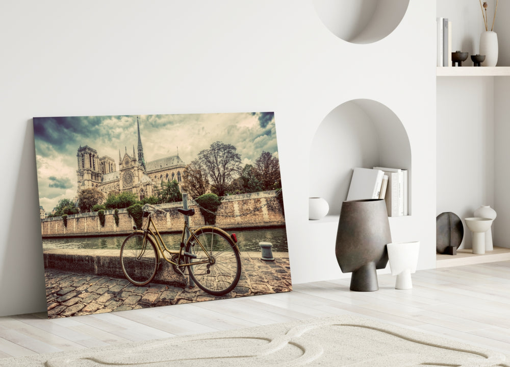 Bicycle glass wall art styled above a reading nook or library sofa