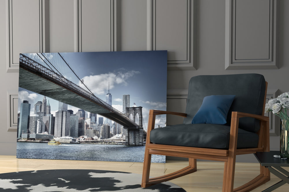 Manhattan Bridge artwork above a dining table in an urban apartment