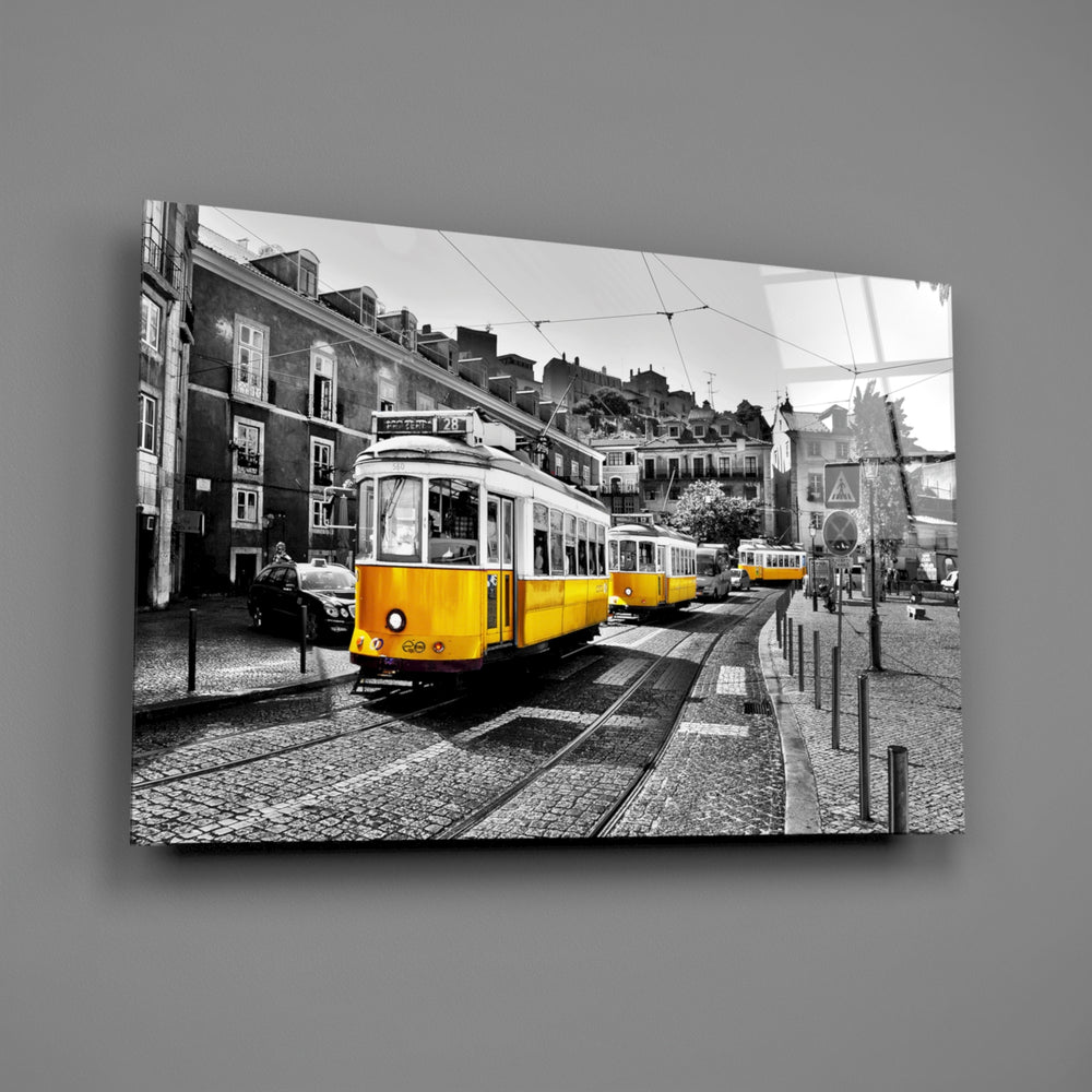 Close-up detail of the yellow tram against black-and-white Lisbon