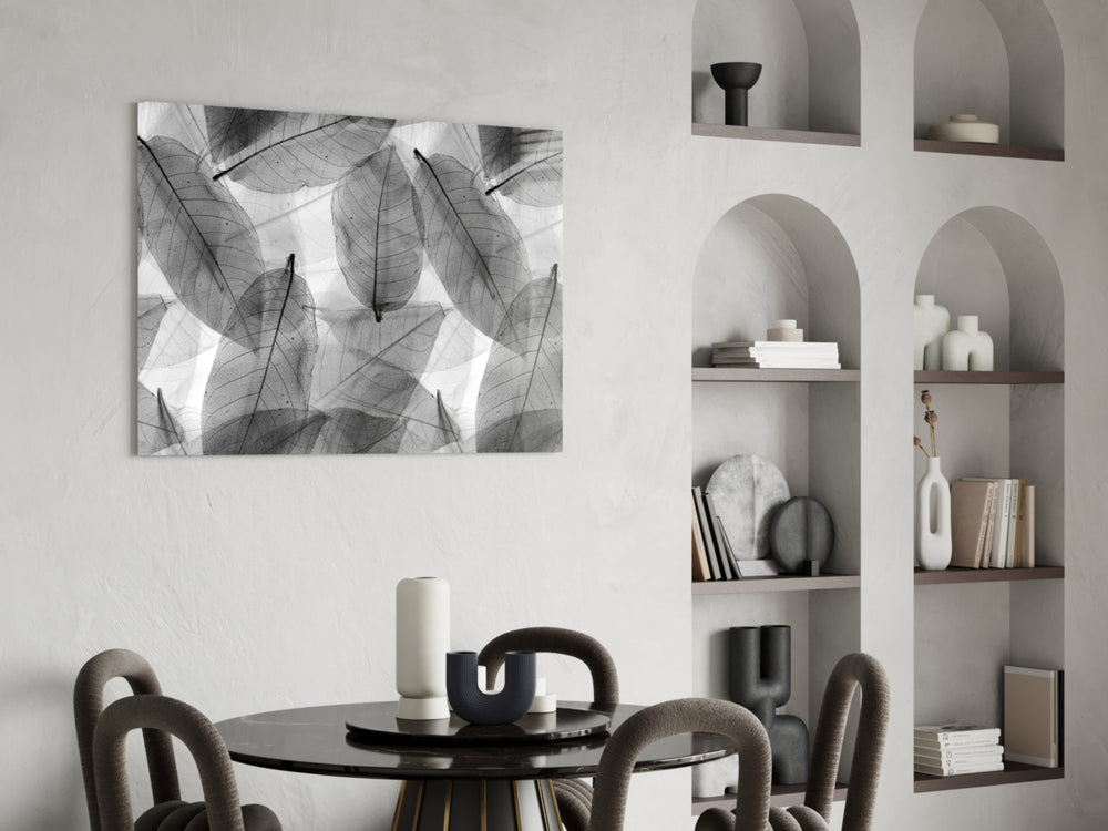 Black and White Leaves glass print enhancing a library or study
