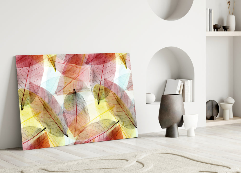 Colorful Leaves glass wall art styled above a bed in a gentle, pastel bedroom
