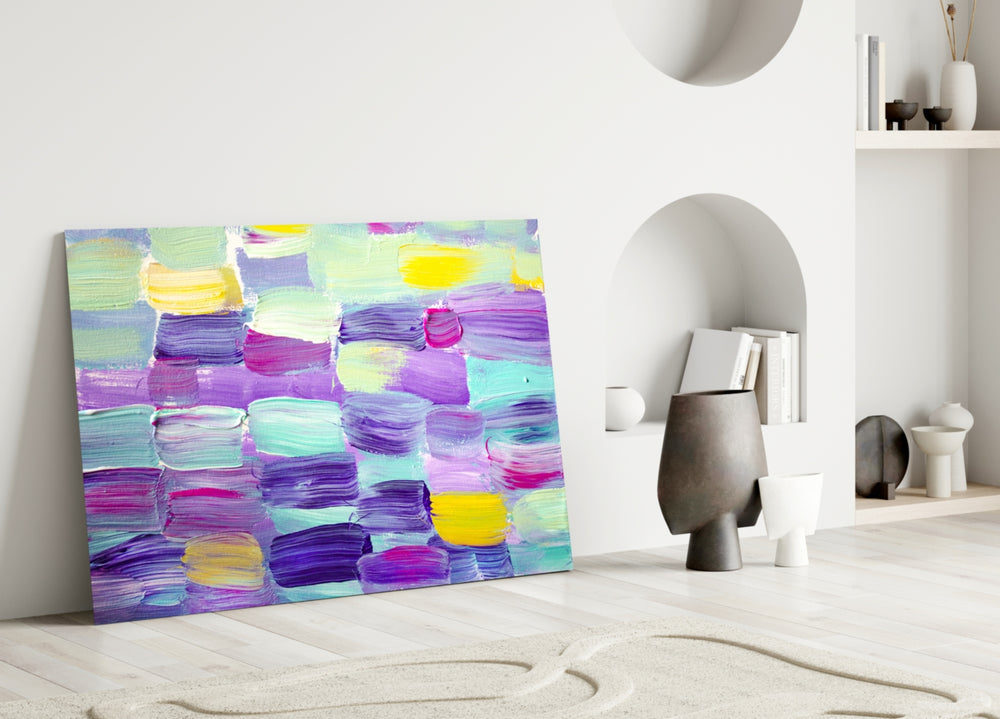 Abstract glass wall art styled above a bed in a soft, feminine bedroom