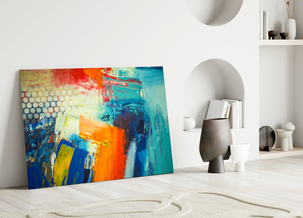 Abstract glass wall art styled above a sofa in a bold, modern living room