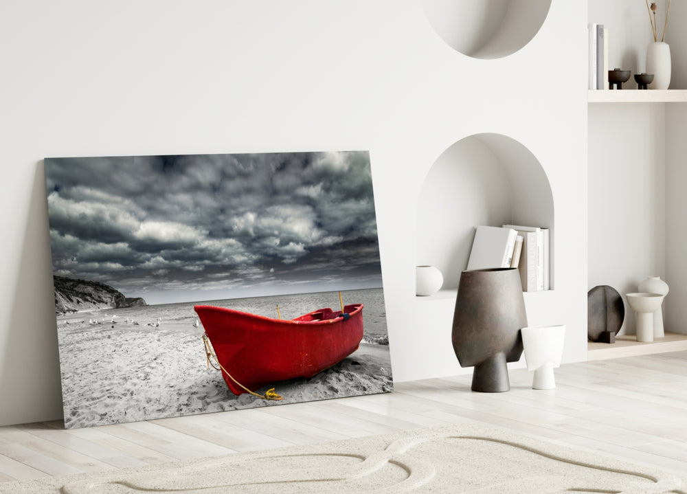 Red Kayak glass wall art styled above a sofa in a moody living room
