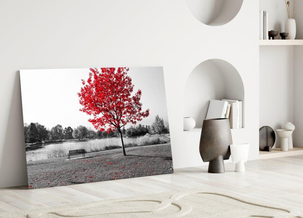 Red Tree glass wall art styled above a sofa in a living room with nature character