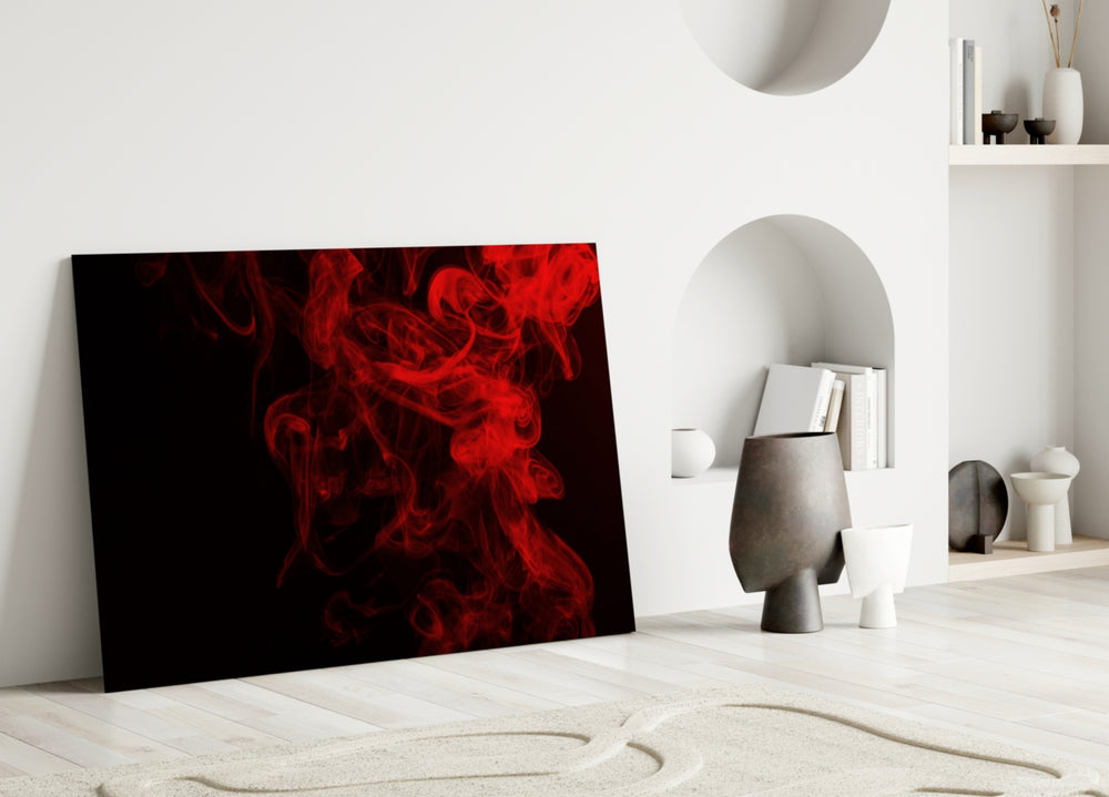 Red Smoke glass wall art styled above a sofa in a dark-walled lounge