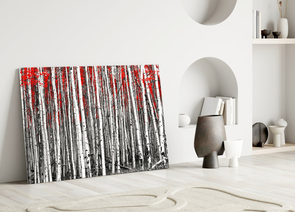 Red Forest glass wall art styled above a bed in a serene bedroom