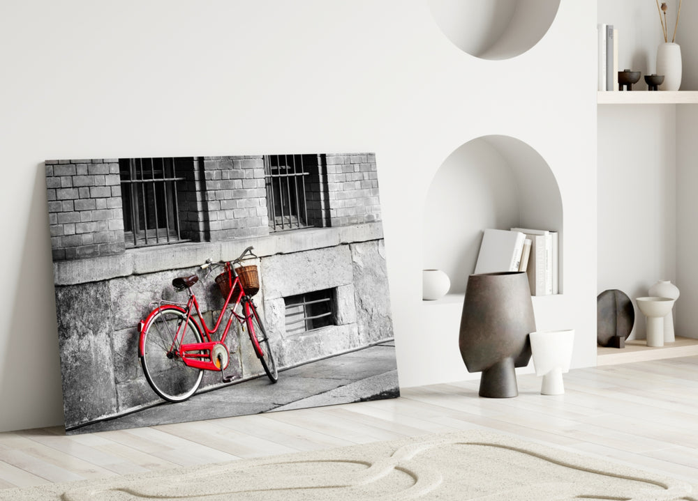 Red Bicycle glass wall art styled above a sofa in a vintage-character living room