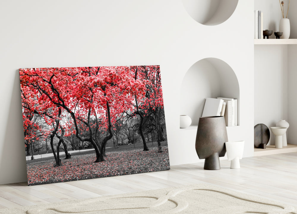 Red Tree glass wall art styled above a bed in a literary bedroom