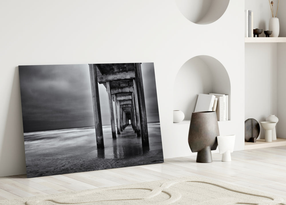Dock glass wall art styled above a sofa in a modern, minimalist living room