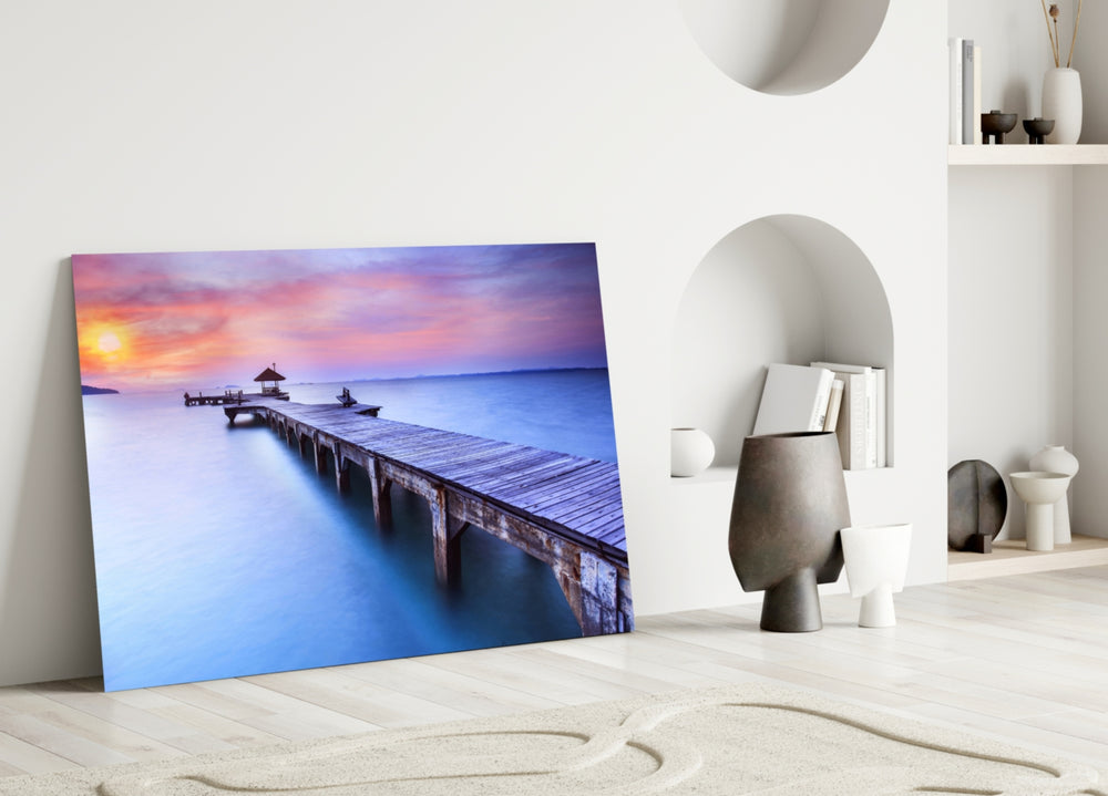 Dock glass wall art styled above a bed in a serene, travel-inspired bedroom