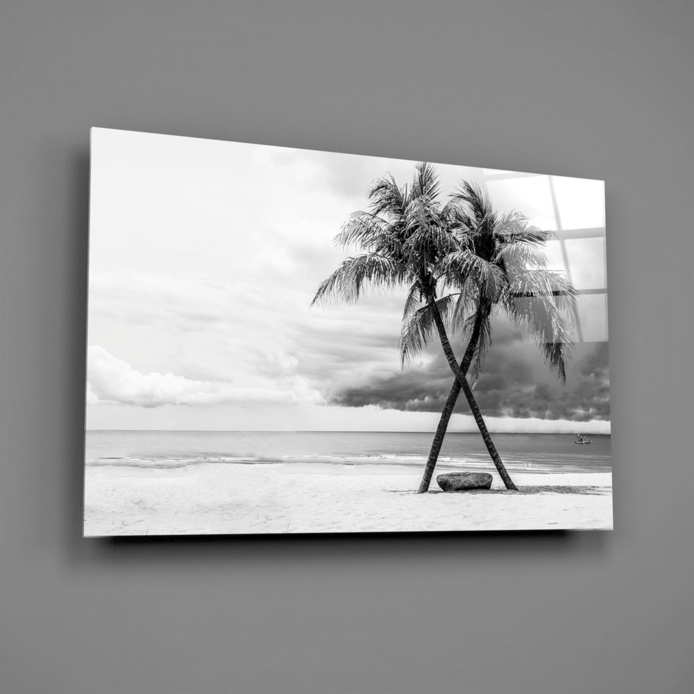 Close-up detail of crossed palm fronds against a soft overcast sky