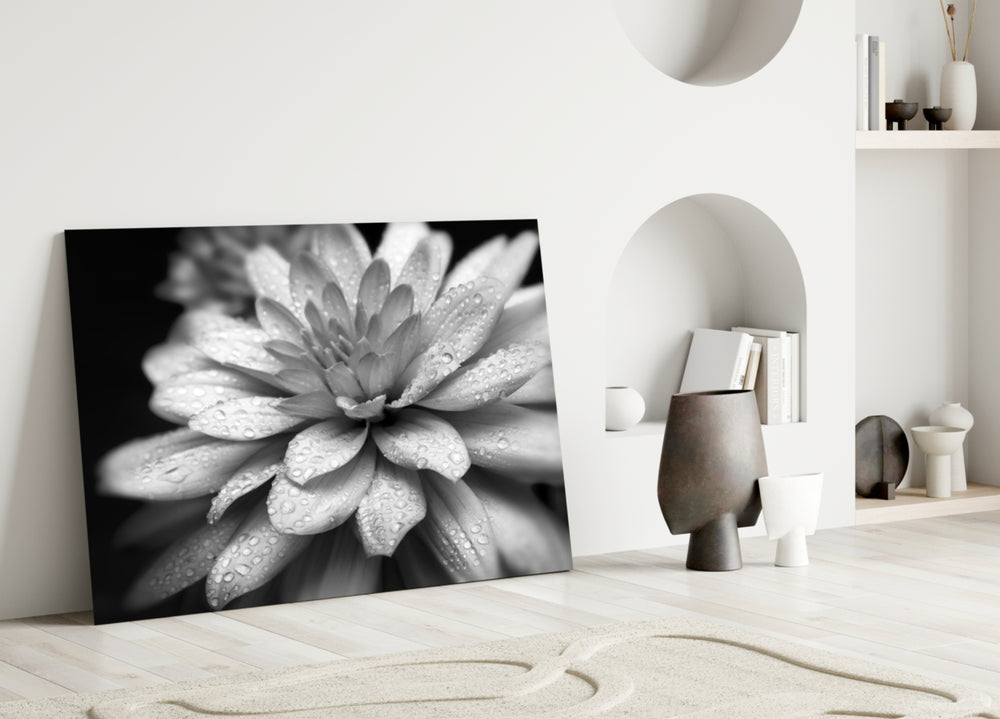 Flower glass wall art styled above a bed in a modern, elegant bedroom