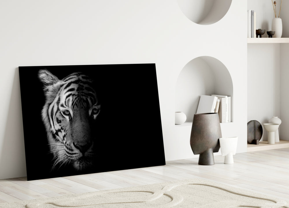 Tiger glass wall art styled above a desk in a focused home office