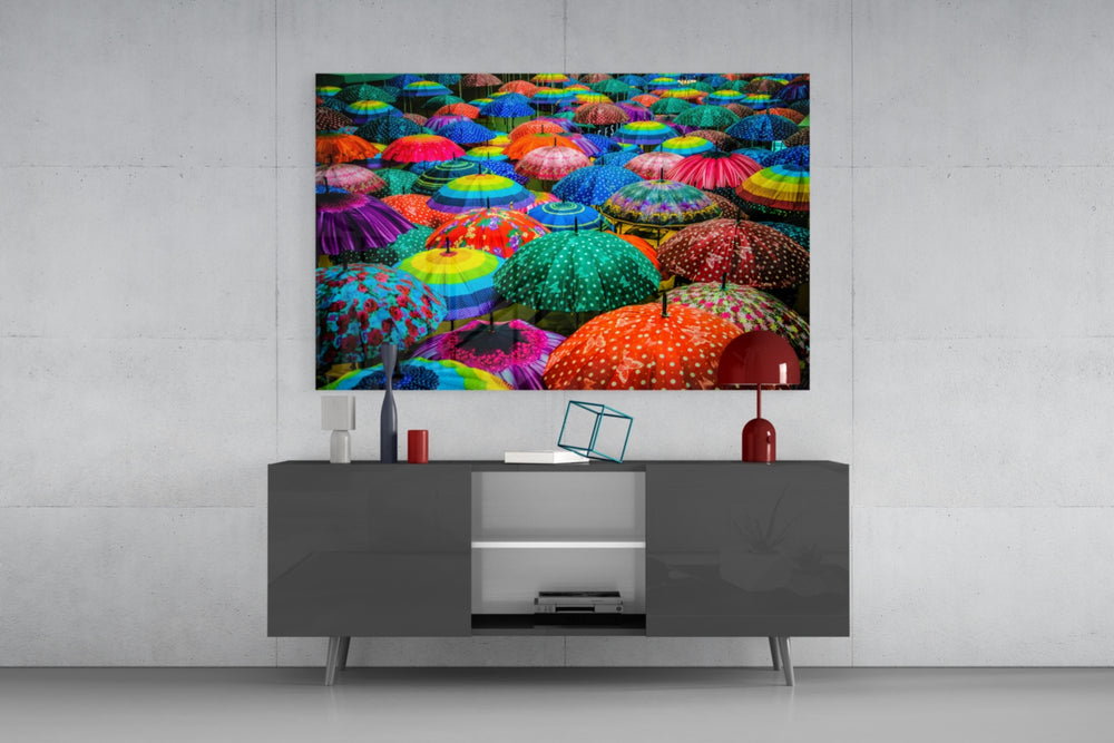 Fine art photography – top-down view of tightly arranged multicolor umbrellas with diverse patterns, textures and vivid colors