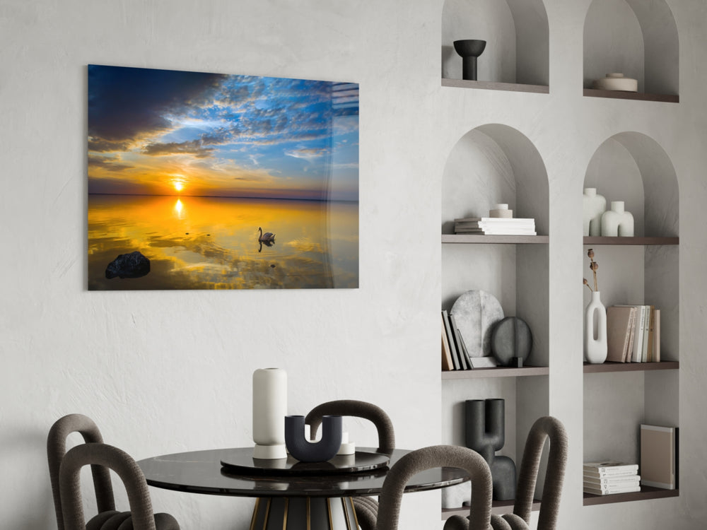 Swan glass print enhancing a dining area with sunset warmth