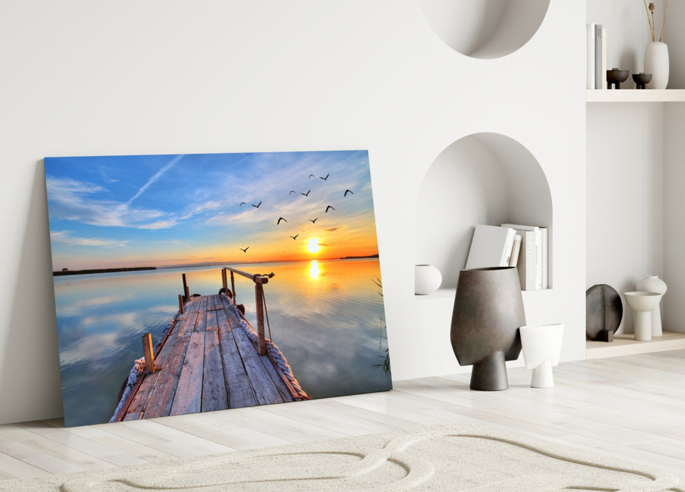 Dock glass wall art styled above a bed in a bright morning bedroom