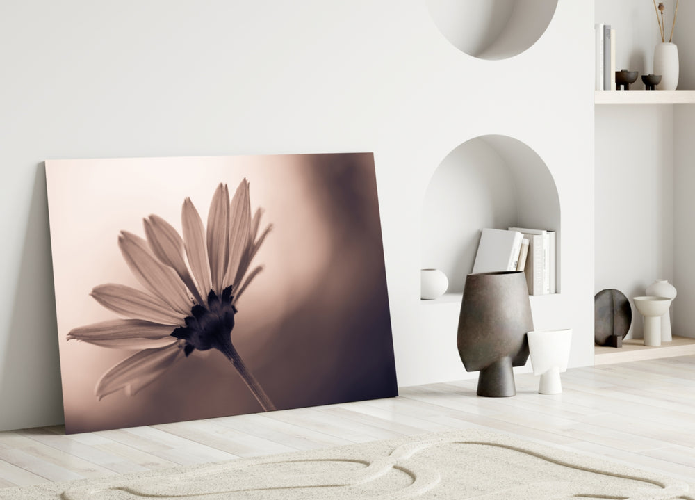 Flower glass wall art styled above a bed in a minimalist bedroom