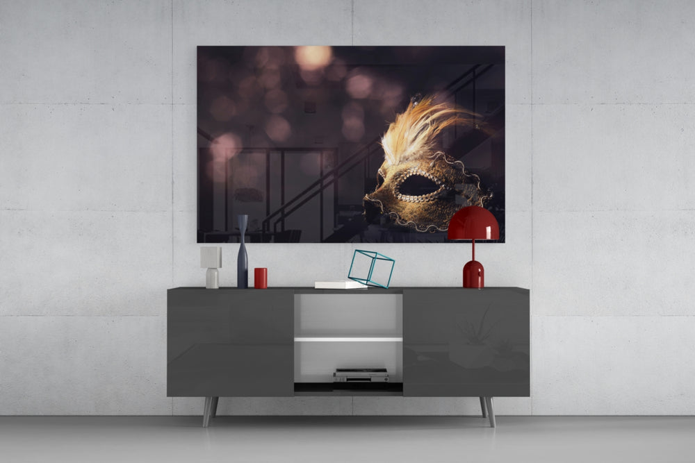 Fine art still life photography – ornate golden Venetian mask with feather adornment, dark background with soft warm bokeh points