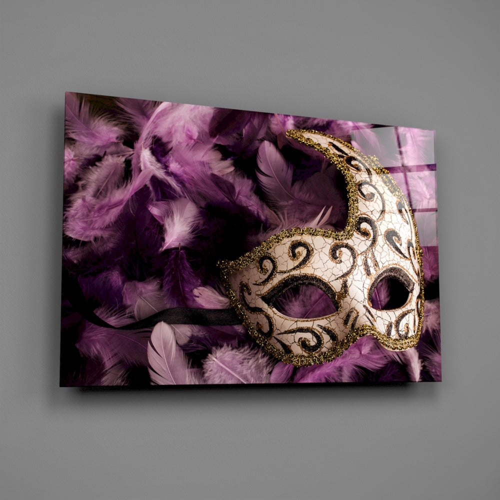 Close-up detail of the ivory Venetian mask on purple feathers